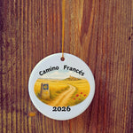 Basic version of Camino Frances ornament in front of wooden door.