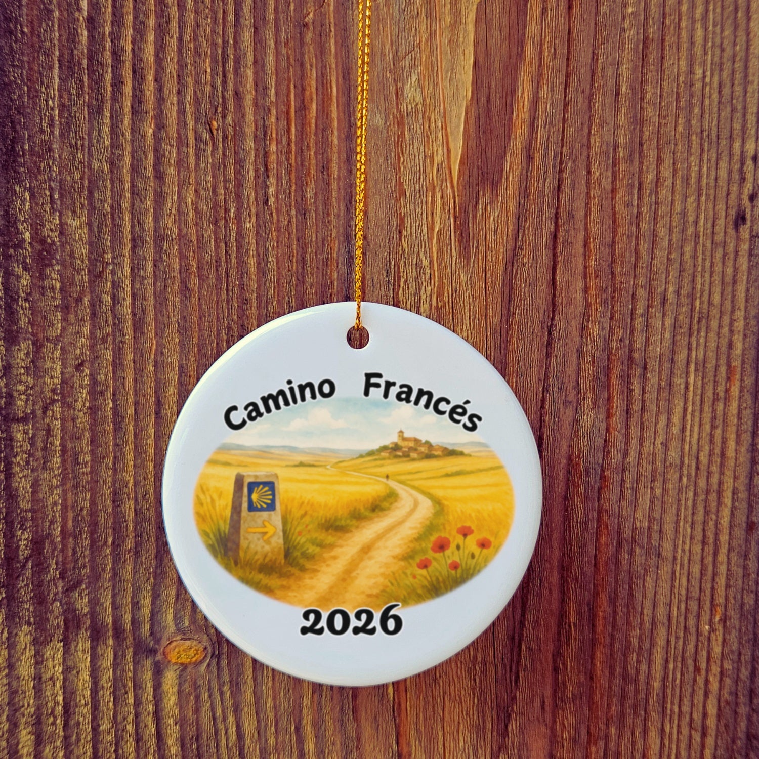 Basic version of Camino Frances ornament in front of wooden door.