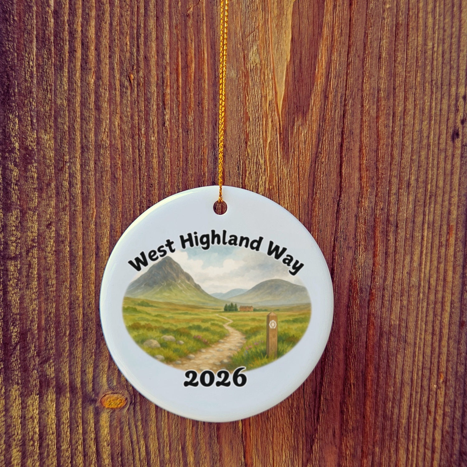 Basic version of West Highland Way ornament in front of wooden door.