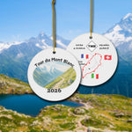 Tour du Mont Blanc ceramic ornament with watercolor landscape shown front and back in front of trail landscape.