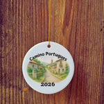 Basic version of Camino Portugues ornament in front of wooden door.