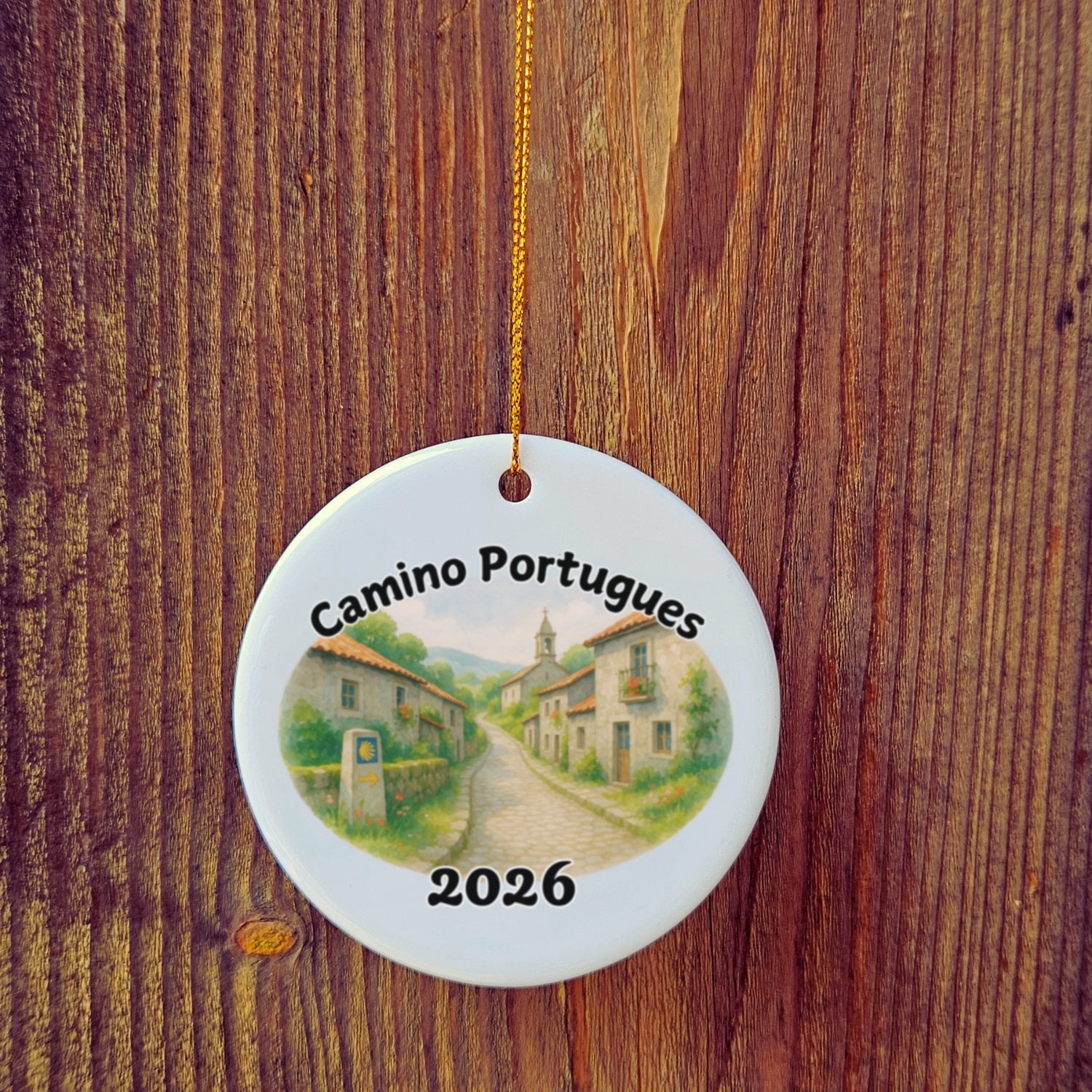Basic version of Camino Portugues ornament in front of wooden door.