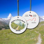 Walker's Haute Route ceramic ornament with watercolor landscape shown front and back in front of trail landscape.
