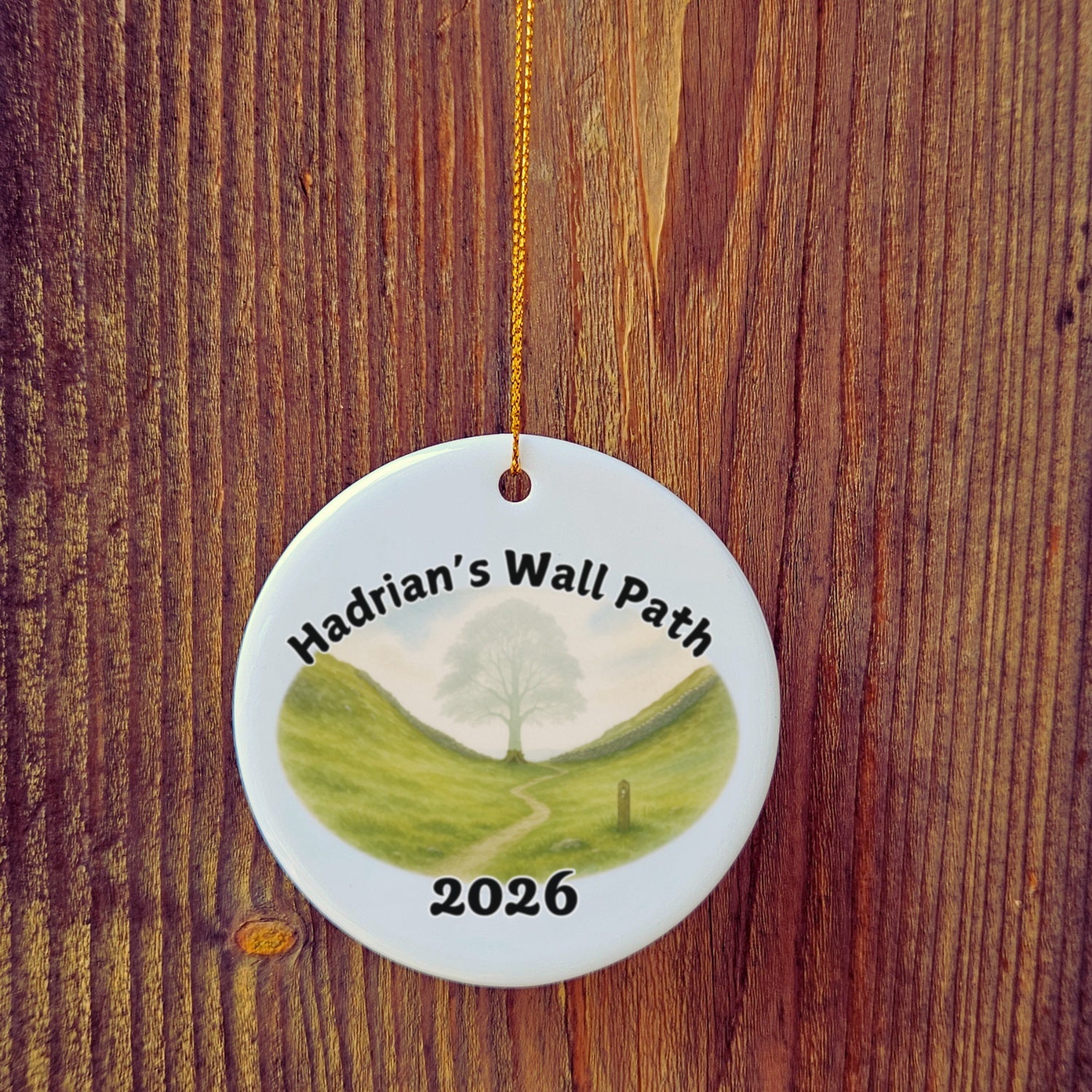 Basic version of Hadrian's Wall Path ornament in front of wooden door.