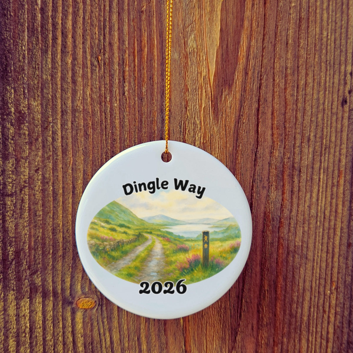 Basic version of The Dingle Way ornament in front of wooden door.