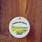 Basic version of Camino del Norte ornament in front of wooden door.