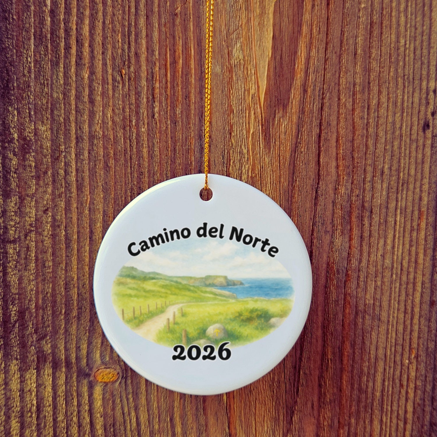 Basic version of Camino del Norte ornament in front of wooden door.