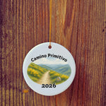 Basic version of Camino Primitivo ornament in front of wooden door.