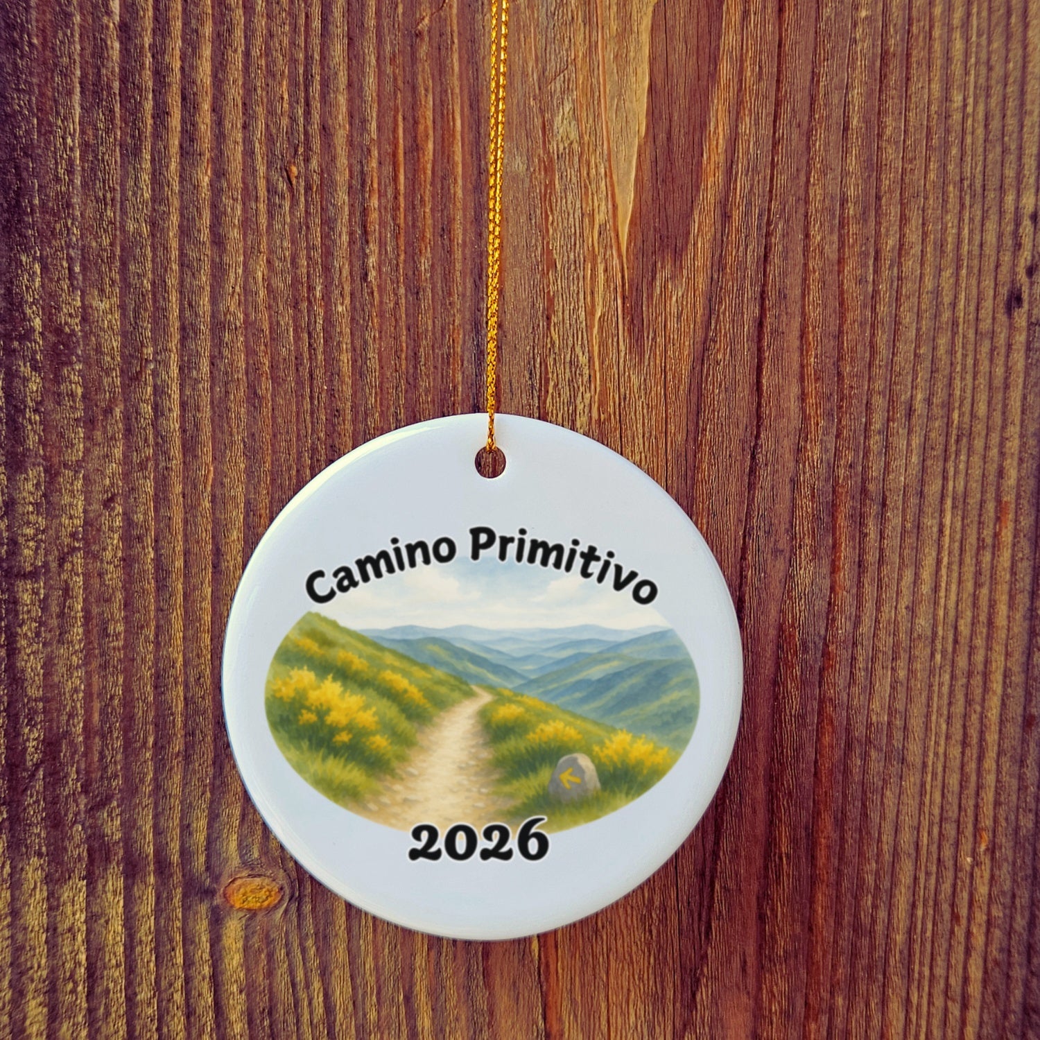 Basic version of Camino Primitivo ornament in front of wooden door.