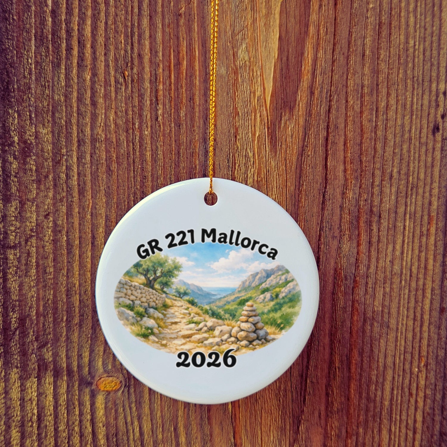 Basic version of GR 221 Trockenmauerweg ornament in front of wooden door.
