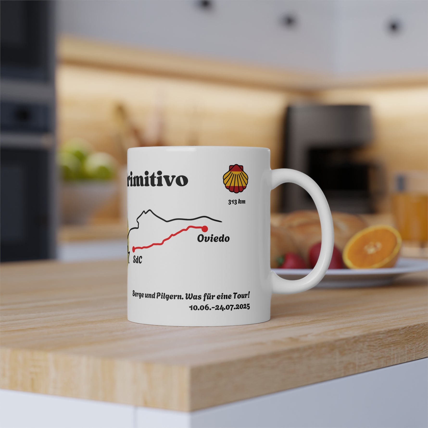 Lifestyle kitchen scene featuring the Camino Primitivo mug with stylized route map and personalized dates displayed.
