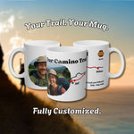 A custom ceramic mug with a hiker's own photo and a stylised map of their route wrapping around it, shown with a sample photo