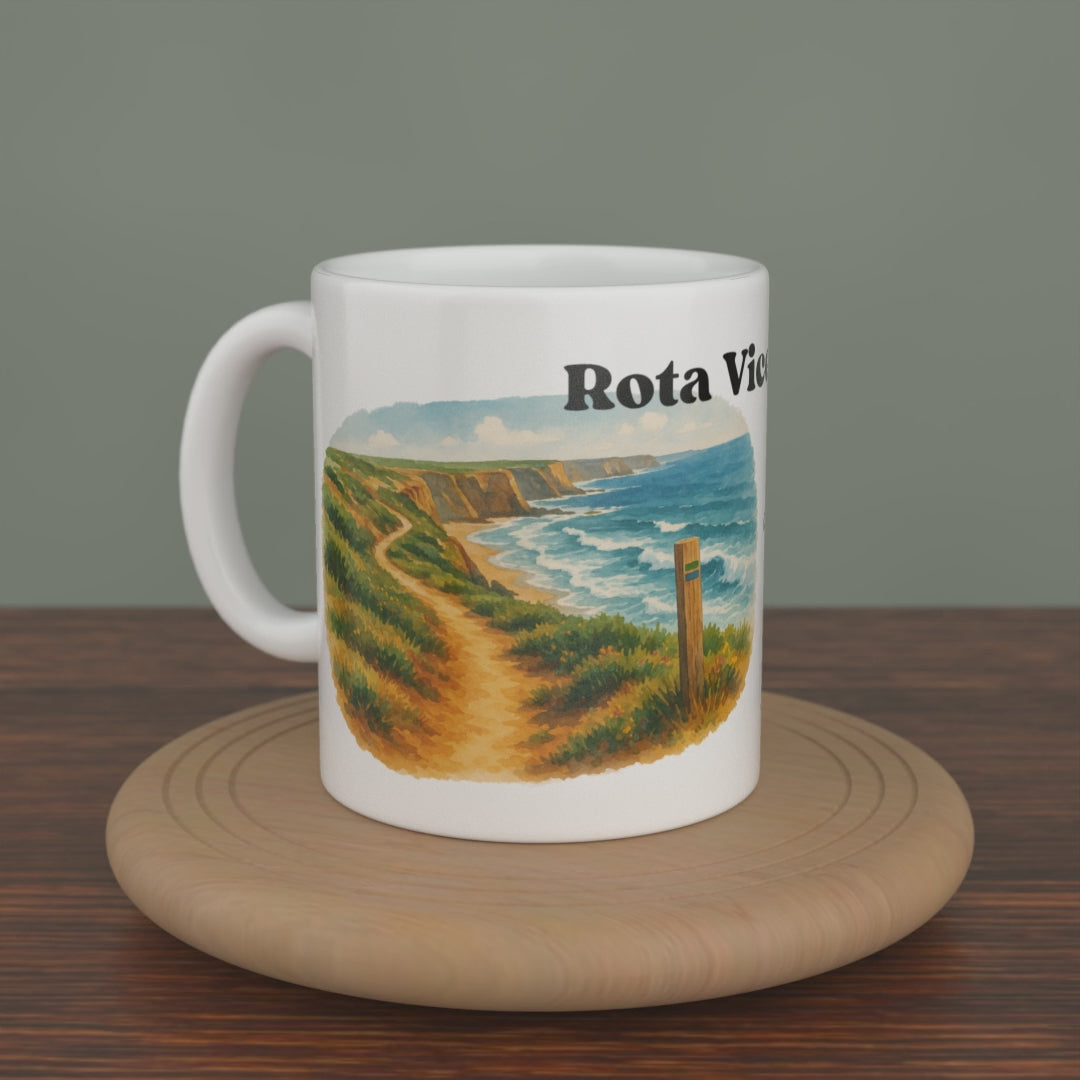 Video of a white Rota Vicentina mug turning slowly, showing both editions: the watercolour map and the photo version.