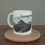 Video of a white Laugavegur Trail mug turning slowly, showing both editions: the watercolour map and the photo version.