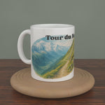 Video of a white Tour du Mont Blanc mug turning slowly, showing both editions: the watercolour map and the photo version.