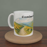 Video of a white Camino Primitivo mug turning slowly, showing both editions: the watercolour map and the photo version.
